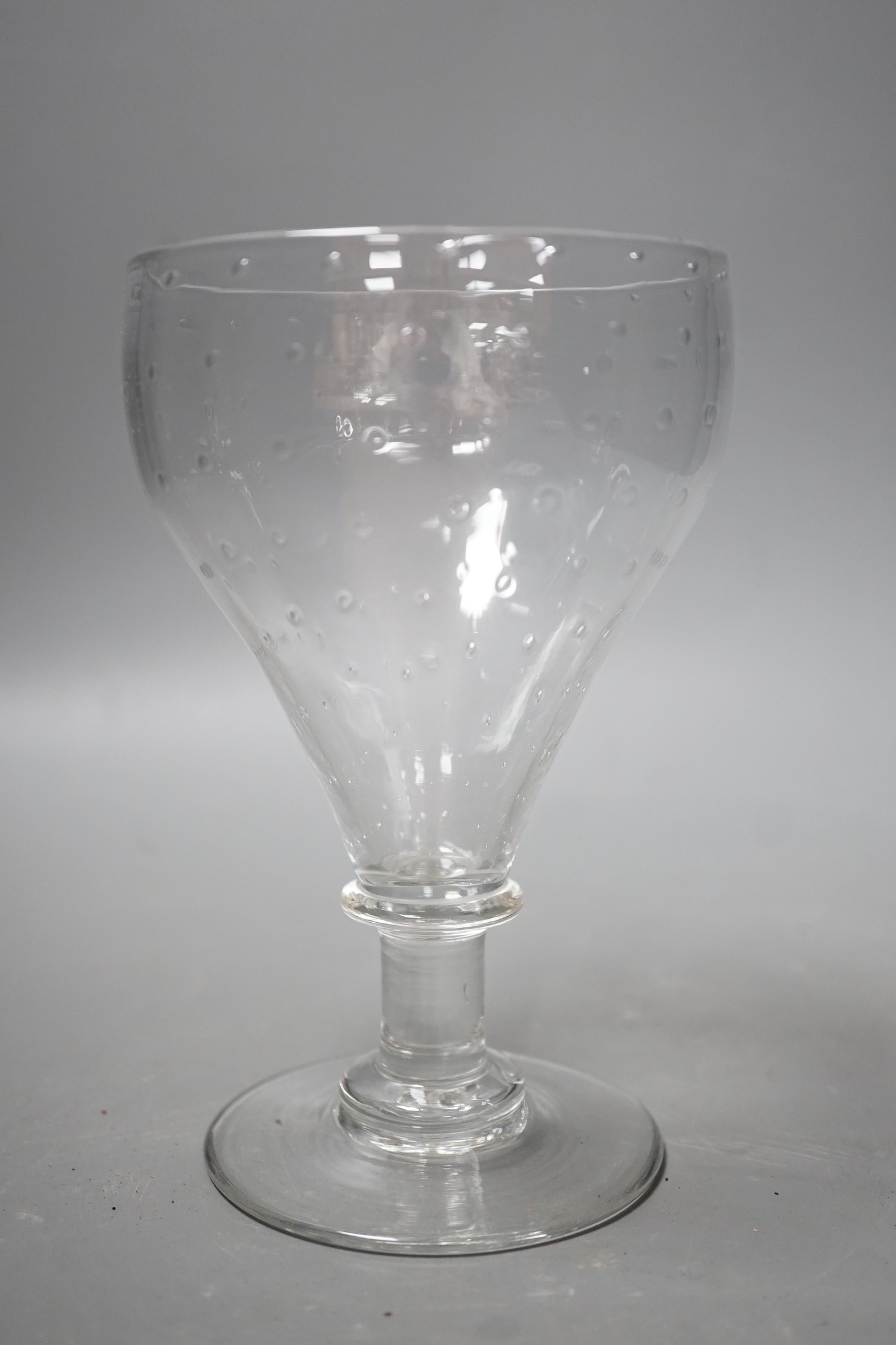 A unusual glass rummer, with a pattern of bubble inclusions to the bowl. 16cm high